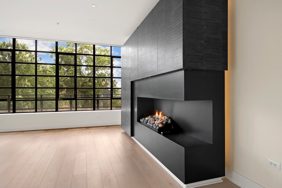 Dramatic DC living room with fireplace and floor-to-ceiling windows