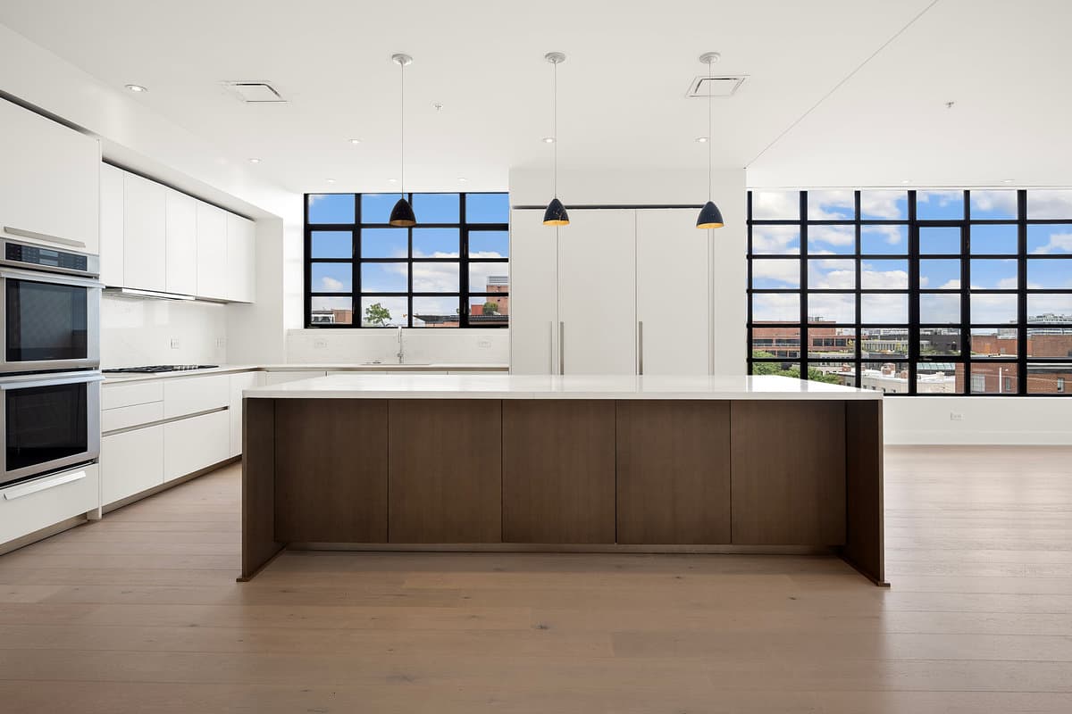 Modern DC kitchen with industrial windows — luxury photography at every price point